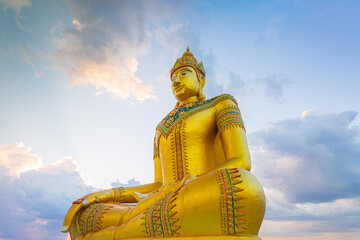 golden buddha,Big Buddha statue outdoors,The giant golden Buddha. The large buddha statue with sunset or sunrise background. buddha statue sitting. Believe, Culture, Traditional. Buddhist believe 