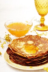 corn pancakes with jam, apricot or peach jam, yellow mimosa