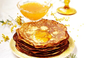 corn pancakes with jam, apricot or peach jam, yellow mimosa