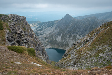 Moody weather above Rila glacier lakes and a pointy mountain summit