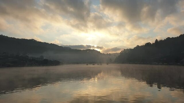 Mae Hong Son, Ruk Thai village morning lake sunrise and slow moving fog with boats crusing in Nature