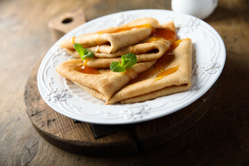 Homemade crepes with apricot jam