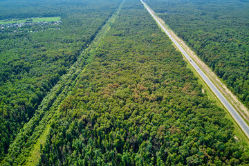 Gas pipeline running parallel to the highway, aerial view