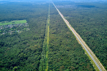 Gas pipeline running parallel to the highway, aerial view