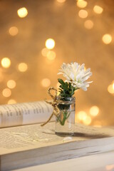 bouquet of flowers on the book