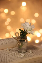 bouquet of flowers on the book