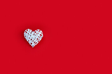 Beautiful heart on a red paper background for Valentine's day. Creative greeting card.