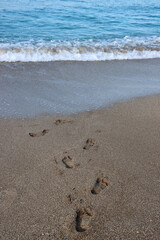 Beautiful seascape photo. Warm day in the beach. Calm blue water, clear sky, no people. 