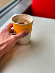 Cappuccino coffee in a takeaway cup