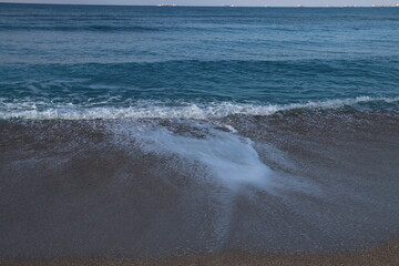 Empty beach photo. Beautiful coastline with calm seawater, sand, no people. 