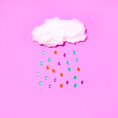 Minimal romantic idea with a soft fluffy cloud and a rain of zircons, on a pink background. Retro...