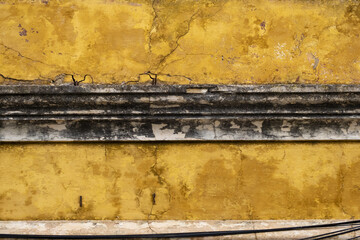 decrepit wall in a square in Faro, Algarve, Portugal