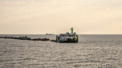 Stones in the water in the harbor