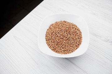 buckwheat in a white plate on the table. buckwheat in the kitchen