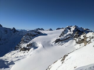 Naklejka premium View on the Gemsfairenstock and in the background the Mountain Clariden. Day of ski touring in the Glarner Alps.