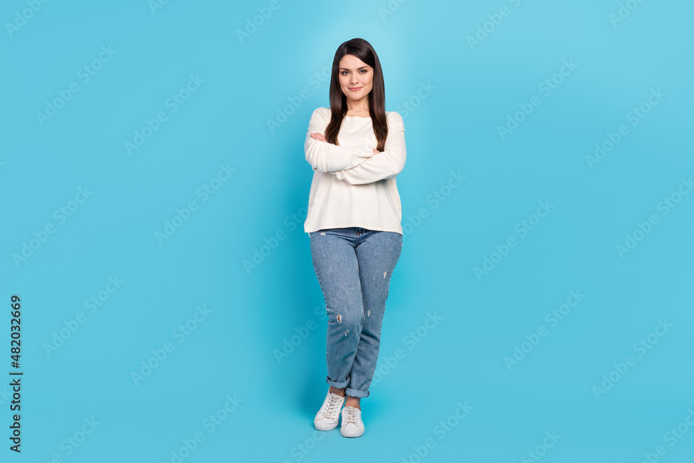 Poster Full length photo of young pretty woman crossed hands standing smart isolated over blue color background