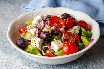 Greek salad with fresh vegetables, feta cheese and kalamata olives. Healthy food.