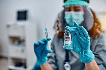 Vaccination and preservation and protection of health. A female doctor in a protective mask and...