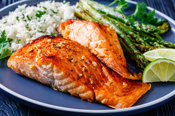 fried salmon fish fillet with rice and asparagus
