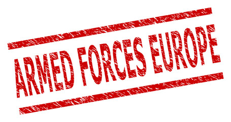 Red ARMED FORCES EUROPE stamp. ARMED FORCES EUROPE stamp with parallel line elements. Rough ARMED FORCES EUROPE stamp in red color, with unclean texture.