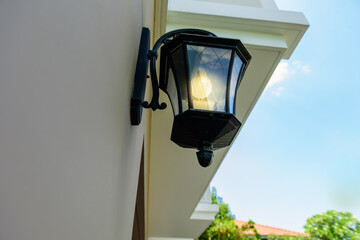 wall lamp in front of the house