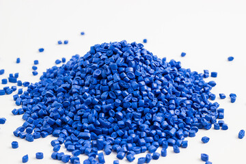 blue granules of polypropylene, polyamide. White background. Plastic and polymer industry. Microplastic products.	