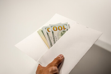 Dollars in a conwind on white background, a lot of money in an envelope.