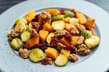 Roasted Brussels Sprouts and Sweet Potatoes with dried cranberries and spicy walnuts