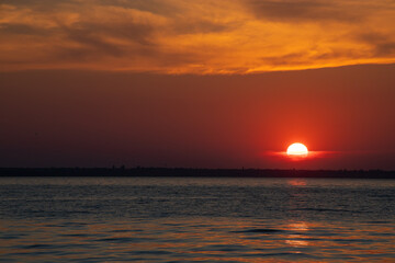 Beautiful red and orang sunset over the lake