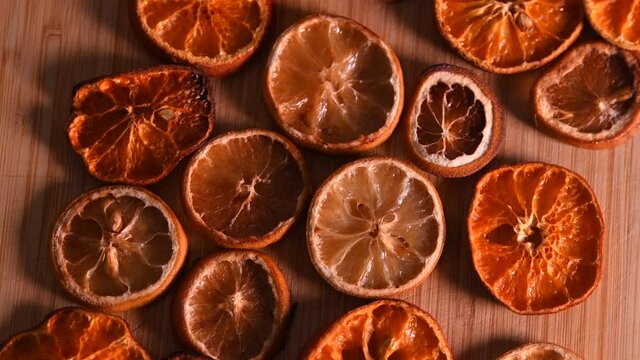 4k video with dehydrated food, dried oranges and lemons. Great texture of this dry citrus. Food and limonade ingredients.