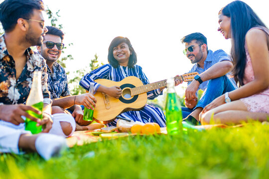 Indian Students Having A Lunch In Delhi Park Outdoors