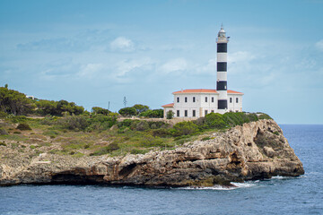 Fototapeta na wymiar Lighthouse Porto Colom Mallorca Balearic Islands Spain in summertime
