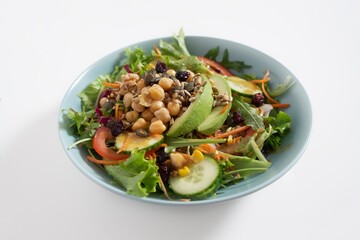 Avocado salad, chickpeas, cucumber, tomato, lettuce, seeds