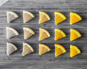 Orange slices on a cutting board, b/w food photography
