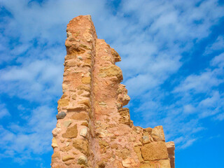 Pointed ruins are isolated on blue sky