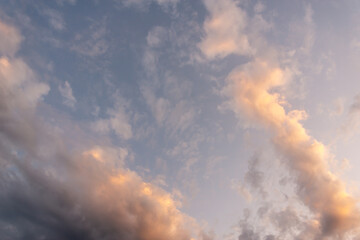 Clouds on a dark sky and a sunbeam.