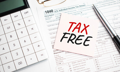 TAX FREE with pen, calculator, glass and sticker. Tax report sign