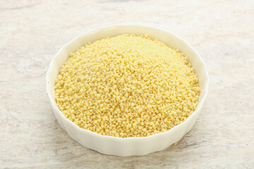 Raw couscous in the bowl