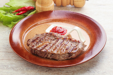 Grilled rib-eye steak beef meat