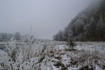 snowy mountain in the fog