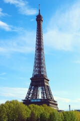 Eiffel tower against the blue sky. Paris, France