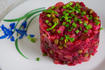 Portion of vinaigrette salad on a plate.