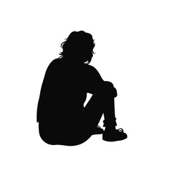 Black silhouette of a person sitting on the floor on a white background
