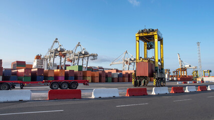 Unloading of containers from a ship on the quay of the port of Le Havre