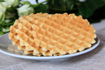 Fresh waffles on a plate served for breakfast