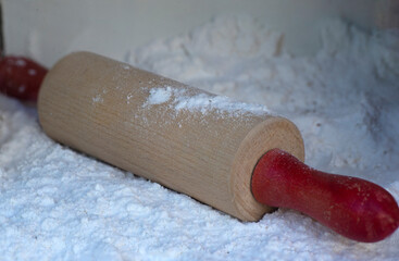 Rolling pin for cookie cutters. Baking gingerbread on a white background. 