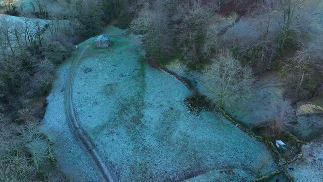 Winter landscape of forests and Pasiega cabins in the Pisue&ntilde;a River Valley. Pasiegos Valleys, Cantabria, Spain, Europe