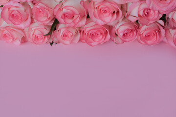 beautiful bouquet of pink roses on pink background. Mother's day, Valentines Day, 8 march. weading, Birthday celebration concept. Greeting card. Copy space, top view