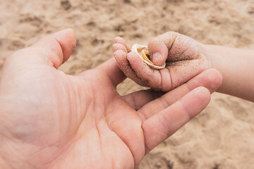 play with your son on the beach