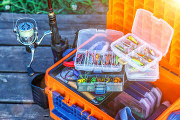 A large fisherman's tackle box fully stocked with lures and gear for fishing.fishing lures and...